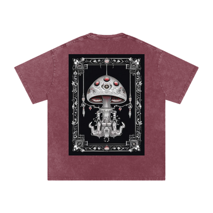 Maroon t-shirt with a central graphic design of a mushroom-like creature with red eyes and decorative elements on a black background.