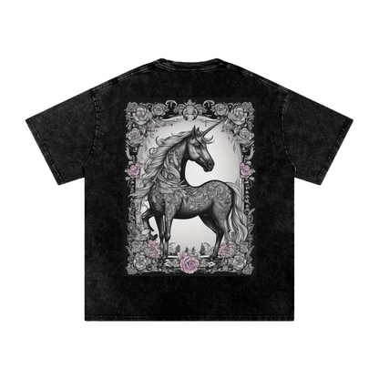 Black t-shirt with a unicorn graphic on a white background