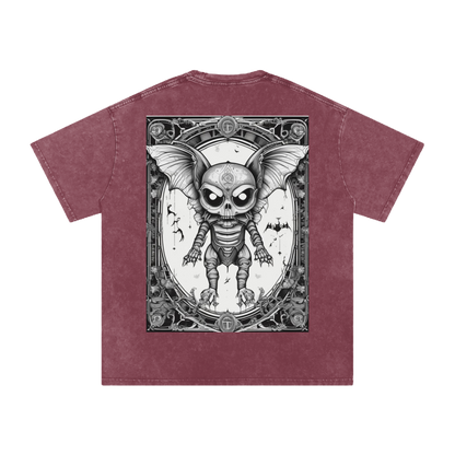 Maroon t-shirt with a graphic design of a skeleton with bat wings on a white background