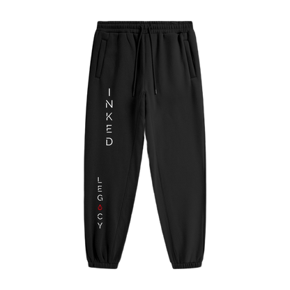 Black jogger pants with 'Inked Legacy' text on a white background
